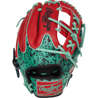 The Rawlings Heart of the Hide 11.5" Color Sync Baseball Glove (PROR204W-32BS) features red and teal colors, teal laces, stylish teal and black patterns, and signature Rawlings branding on the wrist strap and back.