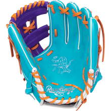 The Rawlings Heart of the Hide 11.75" Baseball Glove (PROR205-32TEP) features a turquoise shell, orange and white laces, a purple interior, and iconic branding on the palm.