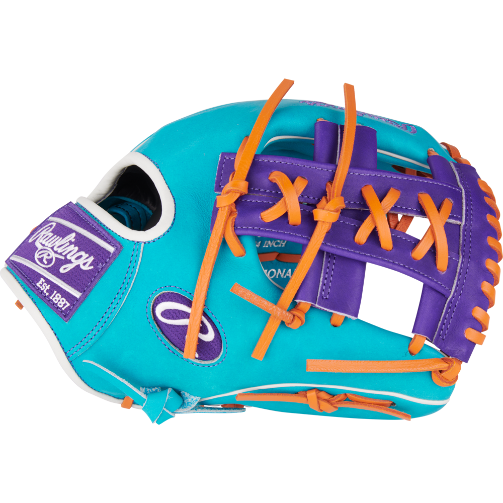 The Rawlings Heart of the Hide 11.75" Baseball Glove (PROR205-32TEP) features bright turquoise leather, orange laces, purple accents, white stitching, and a Rawlings Est. 1887 patch on the side.