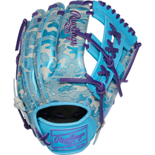 The Rawlings Heart of the Hide 11.75" Baseball Glove (PROR205U-32CBG) features a blue and silver design with a camouflage pattern, purple laces, and "Rawlings" stitched in purple on the back.
