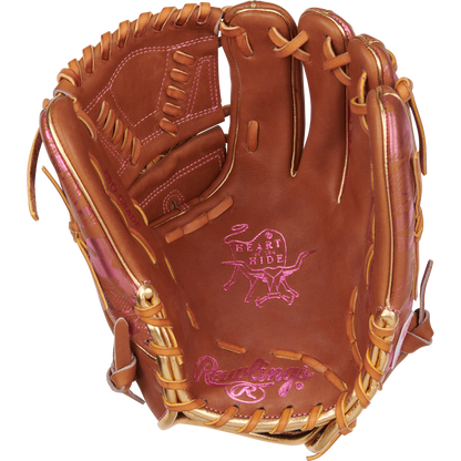 A Rawlings Heart of the Hide 11.75" Color Sync Baseball Glove (PROR205W-30GB) in brown with pink stitching and laces, shown open with visible branding on the palm and thumb.