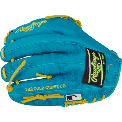 The Rawlings Heart of the Hide 12" Color Sync Baseball Glove (PROR206CFB-11TE) features a turquoise design with yellow laces, the Rawlings logo and "THE GOLD GLOVE CO." text in yellow, plus a black and white MLB logo patch near the wrist.