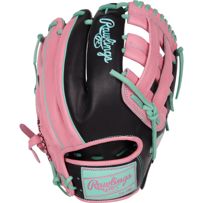 The Rawlings Heart of the Hide 12.25" Color Sync Baseball Glove (PROR207-6BP) features a black base with pink and teal accents, teal laces, a pink Rawlings logo, open webbing, and is designed for outfielders.