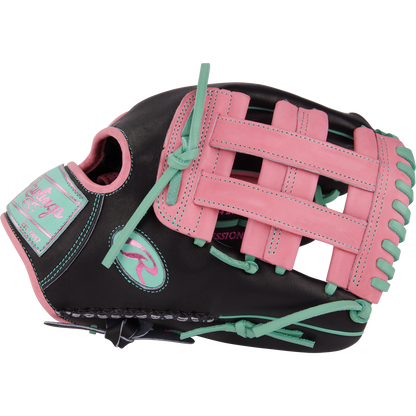 The Rawlings Heart of the Hide 12.25" Color Sync Baseball Glove (PROR207-6BP) features a black design with pink and teal laces, stitching, and accents, plus a pink patch, teal webbing highlights, and bold branding details.