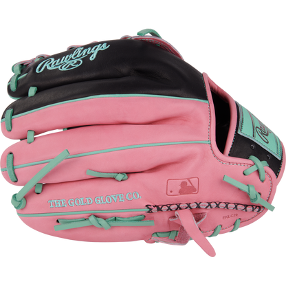 The Rawlings Heart of the Hide 12.25" Color Sync Baseball Glove (PROR207-6BP) features a pink and black design with teal laces and accents, Rawlings logo, THE GOLD GLOVE CO. text, and a small MLB logo.