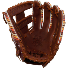 The Rawlings Heart of the Hide 11.75" Baseball Glove (PROR2175-13TI) features brown leather with tan, red, and white striped accents plus embossed Rawlings and Heart of the Hide logos.