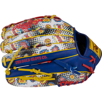 The Rawlings Heart of the Hide 12.75" Color Sync Baseball Glove (PROR3039-6RSS) boasts a comic book-inspired design with blue, yellow, white, and red pop art accents and "THE GOLD GLOVE CO." stitched on the side.