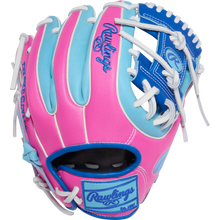The Rawlings Heart of the Hide 11.25" Baseball Glove (PROR312U-2CB) features a vibrant pink, blue, and light blue design with white laces and the Rawlings logo on the wrist strap and back of hand.