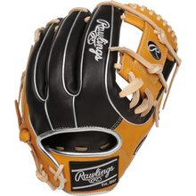The Rawlings Heart of the Hide 11.5" Baseball Glove (RPROR314-2BTC) features black and tan leather, white stitching, tan laces, and the Rawlings logo on the wrist strap and thumb—designed for elite performance.