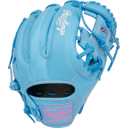 The Rawlings Heart of the Hide 11.5" Baseball Glove (PROR314-2CBCB) features a closed web, light blue color with pink stitching, and Rawlings logos on the glove and wrist strap. Designed for right-handed infield players.