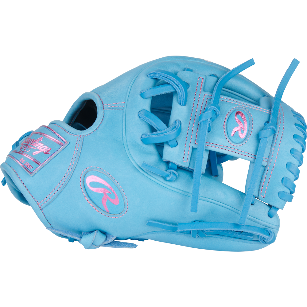 A Rawlings Heart of the Hide 11.5" PROR314-2CBCB baseball glove in light blue with pink stitching and accents, including the Rawlings logo and name, is shown against a plain white background.