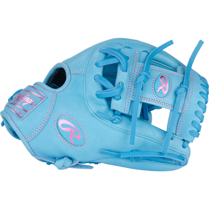 A Rawlings Heart of the Hide 11.5" PROR314-2CBCB baseball glove in light blue with pink stitching and accents, including the Rawlings logo and name, is shown against a plain white background.