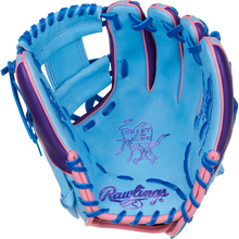 The Rawlings Heart of the Hide 11.5" Color Sync Baseball Glove (PROR314-2CBPU) features blue and pink leather, purple "HEART OF THE HIDE" stitching, an illustrated steer logo on the palm, blue laces, and pink accents on the fingers.