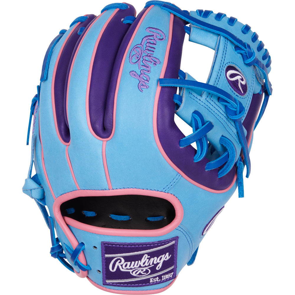 The Rawlings Heart of the Hide 11.5" Color Sync Baseball Glove (PROR314-2CBPU) features blue, purple, and pink colors with bright blue laces and the Rawlings logo on the wrist patch and thumb.