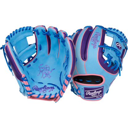Two blue Rawlings Heart of the Hide 11.5" Color Sync gloves (PROR314-2CBPU) with pink and purple accents are displayed, showing both palm and back, with playful graphics and the Rawlings logo on palm and wrist.