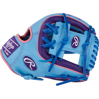 The Rawlings Heart of the Hide 11.5" Color Sync Baseball Glove (PROR314-2CBPU) is a blue and purple infield glove with pink accents, blue laces, and features the Rawlings logo plus “Est. 1887” on a patch.
