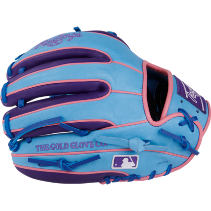 The Rawlings Heart of the Hide 11.5" Color Sync Baseball Glove (PROR314-2CBPU) features blue leather with purple and pink accents, standout stitching, Rawlings branding, “The Gold Glove Co.” text, and an MLB logo on the wrist strap.