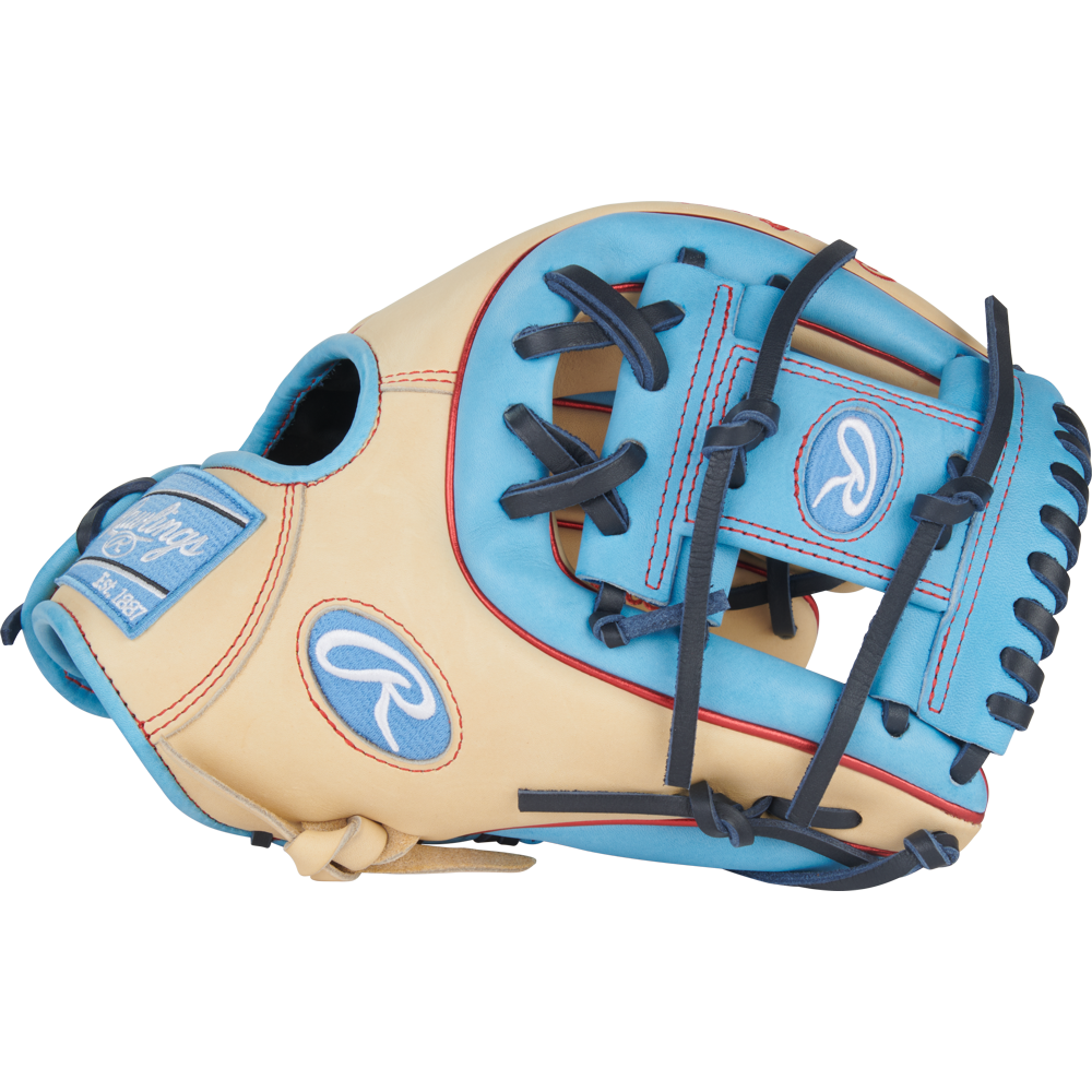 The Rawlings Heart of the Hide 11.5" Baseball Glove (PROR314-2CCB) features a beige and light blue design with dark blue laces, plus the Rawlings logo on the wrist strap and thumb, combining style and performance for infield play.