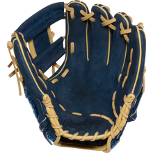 The Rawlings Heart of the Hide 11.5" Baseball Glove (PROR314-2XDN) features blue and tan leather, visible stitching, and an embossed Rawlings logo on the palm. The open glove reveals its inside pocket and finger slots.