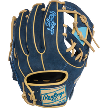 The Rawlings Heart of the Hide 11.5" Baseball Glove (PROR314-2XDN) features a blue design with tan laces and trim, plus light blue Rawlings logos and patches on the back and wrist strap.
