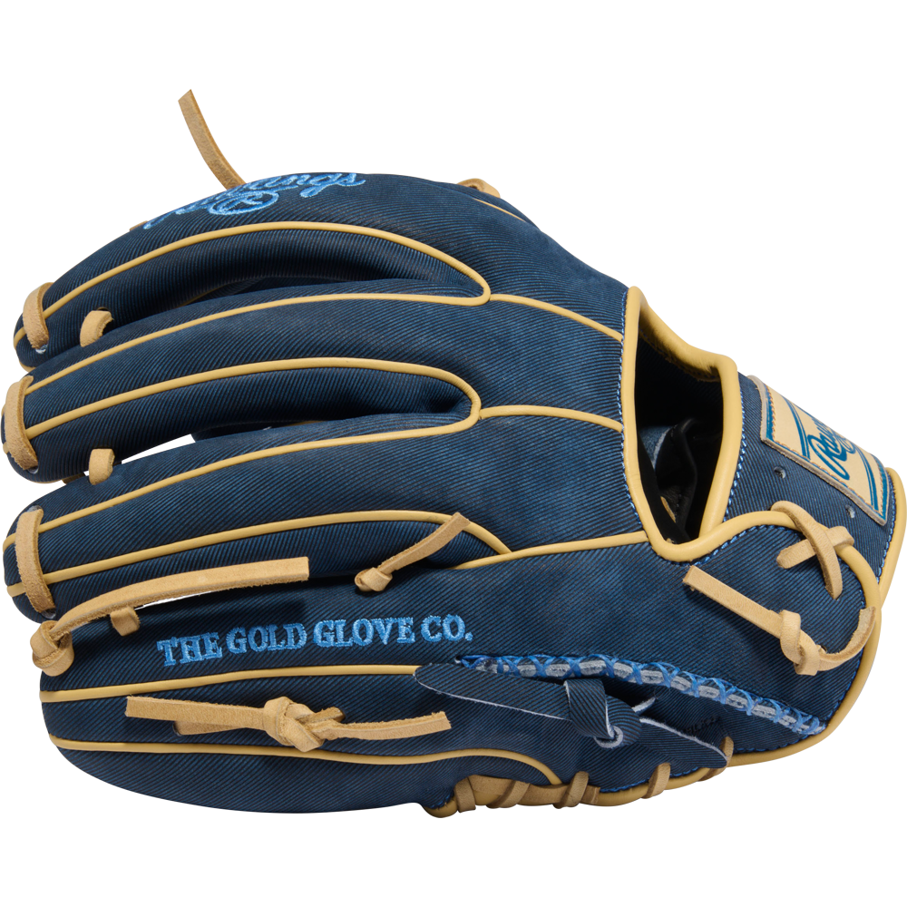 The Rawlings Heart of the Hide 11.5" Baseball Glove (PROR314-2XDN) features a dark blue design with tan laces and trim, light blue "THE GOLD GLOVE CO." embroidery, plus decorative stitching and branding on the interior.