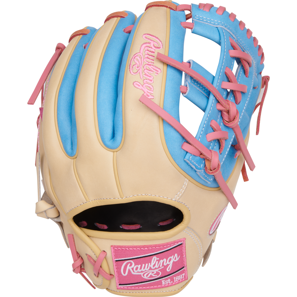 The Rawlings Heart of the Hide 11.5" Baseball Glove (PROR314-32CCB) features tan leather with blue and pink accents, pink laces, a pink Rawlings logo, and “Est. 1887” on the wrist—ideal for infielders.