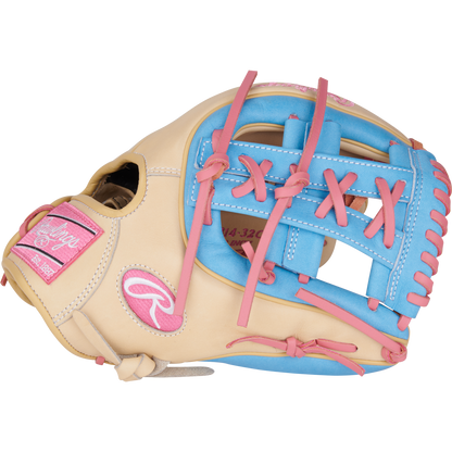 The Rawlings Heart of the Hide 11.5" Baseball Glove (PROR314-32CCB) features a beige design with pink laces, blue trim, and a pink logo patch. It's pictured on a plain white background.