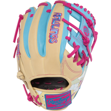 The Rawlings Heart of the Hide Icon Fest 11.5" Baseball Glove (PROR934-2CBE) features beige, blue, and pink premium steerhide leather with bright pink laces, pastel blue accents, and playful cloud embroidery near the wrist.