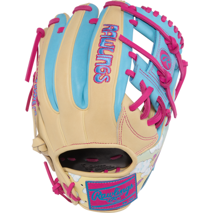 The Rawlings Heart of the Hide Icon Fest 11.5" Baseball Glove (PROR934-2CBE) features beige, blue, and pink premium steerhide leather with bright pink laces, pastel blue accents, and playful cloud embroidery near the wrist.