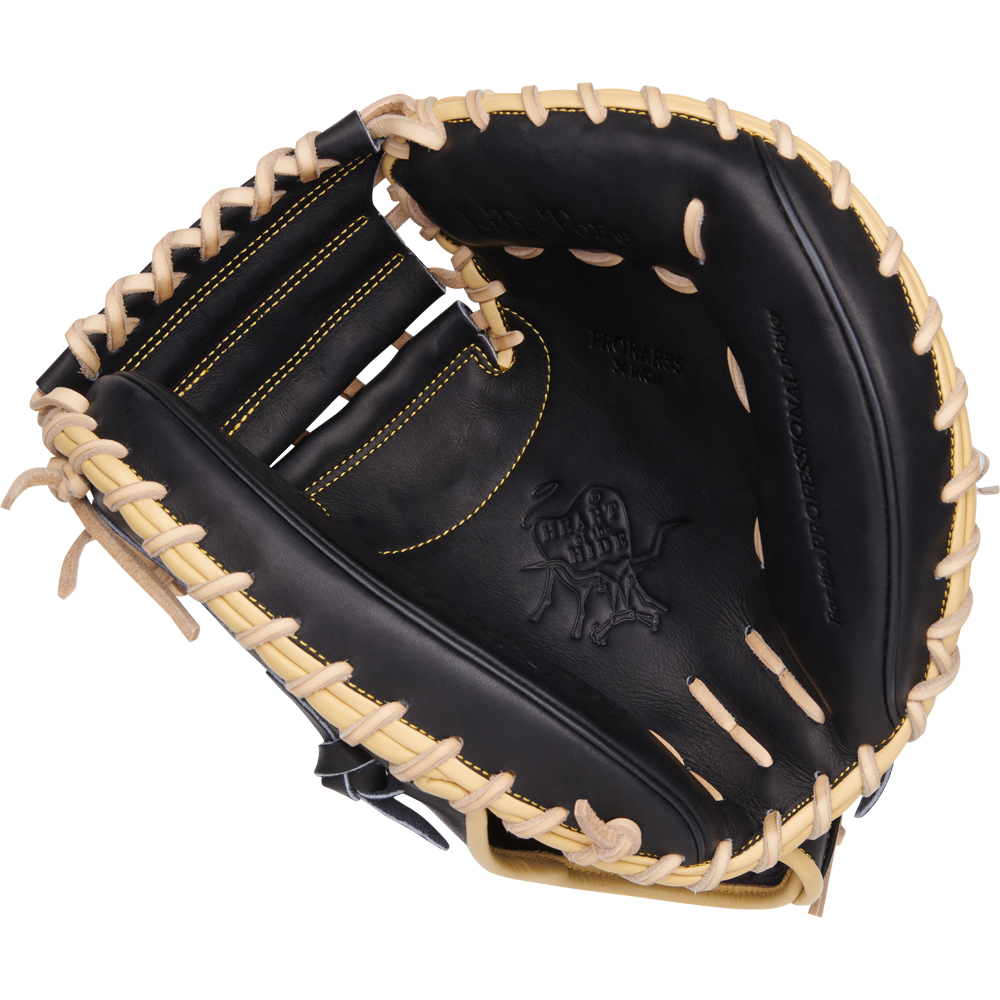 A Rawlings Heart of the Hide 34" Adley Rutschman catcher's mitt (PRORAR35) in black with light tan laces, yellow stitching, and an embossed palm logo is displayed on a plain white background.