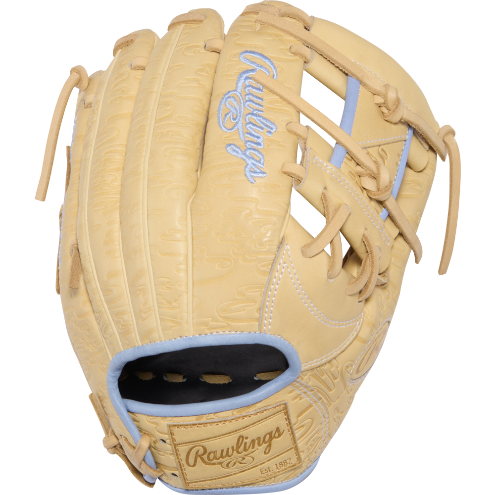 A tan Rawlings Heart of the Hide 11.5″ baseball glove (model PRORB734-2XC), featuring light blue accents and lacing, with embroidered branding on both the glove’s surface and wrist strap.