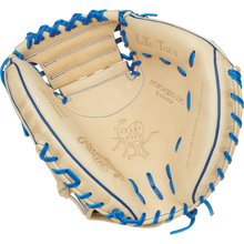 The Rawlings Heart of the Hide 32.5" Catcher's Mitt (PRORCM325U-23C) features tan leather, blue laces, a Contour Fit design, and detailed stitching and imprints for a premium look and feel.
