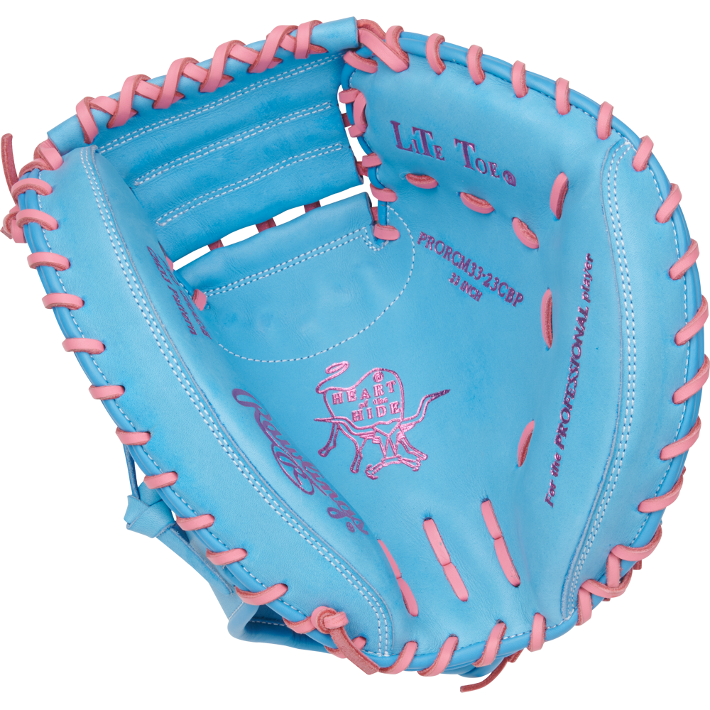 The Rawlings Heart of the Hide 33" Catcher's Mitt (PRORCM33-23CBP) features a blue design with pink lacing and stitching, the iconic Rawlings logo, and detailed text inside the glove.