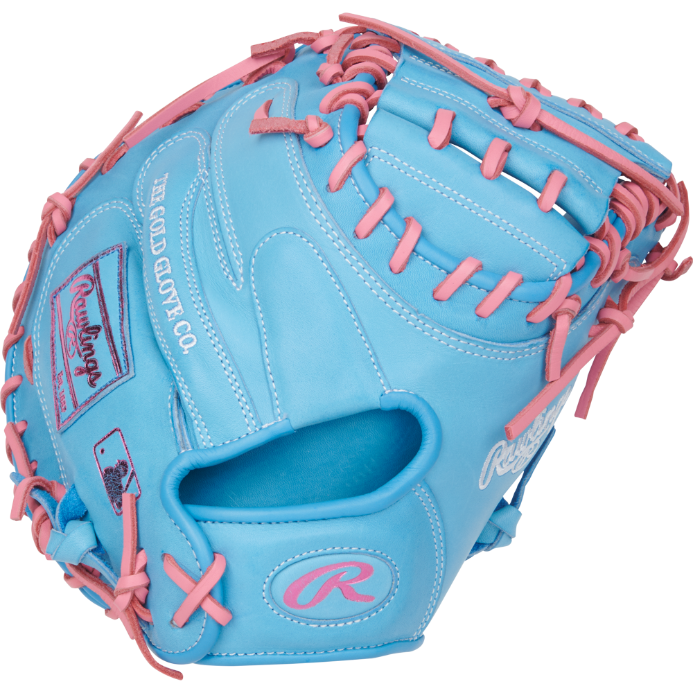 The Rawlings Heart of the Hide 33" Catcher's Mitt (PRORCM33-23CBP) features sky blue leather with pink laces, The Gold Glove Co. logos, and detailing in white and pink embroidery.