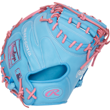 The Rawlings Heart of the Hide 33" Catcher's Mitt (PRORCM33-23CBP) features sky blue leather with pink laces, The Gold Glove Co. logos, and detailing in white and pink embroidery.