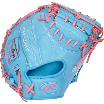 The Rawlings Heart of the Hide 33" Catcher's Mitt (PRORCM33-23CBP) features sky blue leather with pink laces, The Gold Glove Co. logos, and detailing in white and pink embroidery.