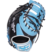 The Rawlings Heart of the Hide 13" First Base Mitt (PRORDCT-10CB) features a black and light blue design with white accents, black laces, and the Rawlings logo on the wrist strap.