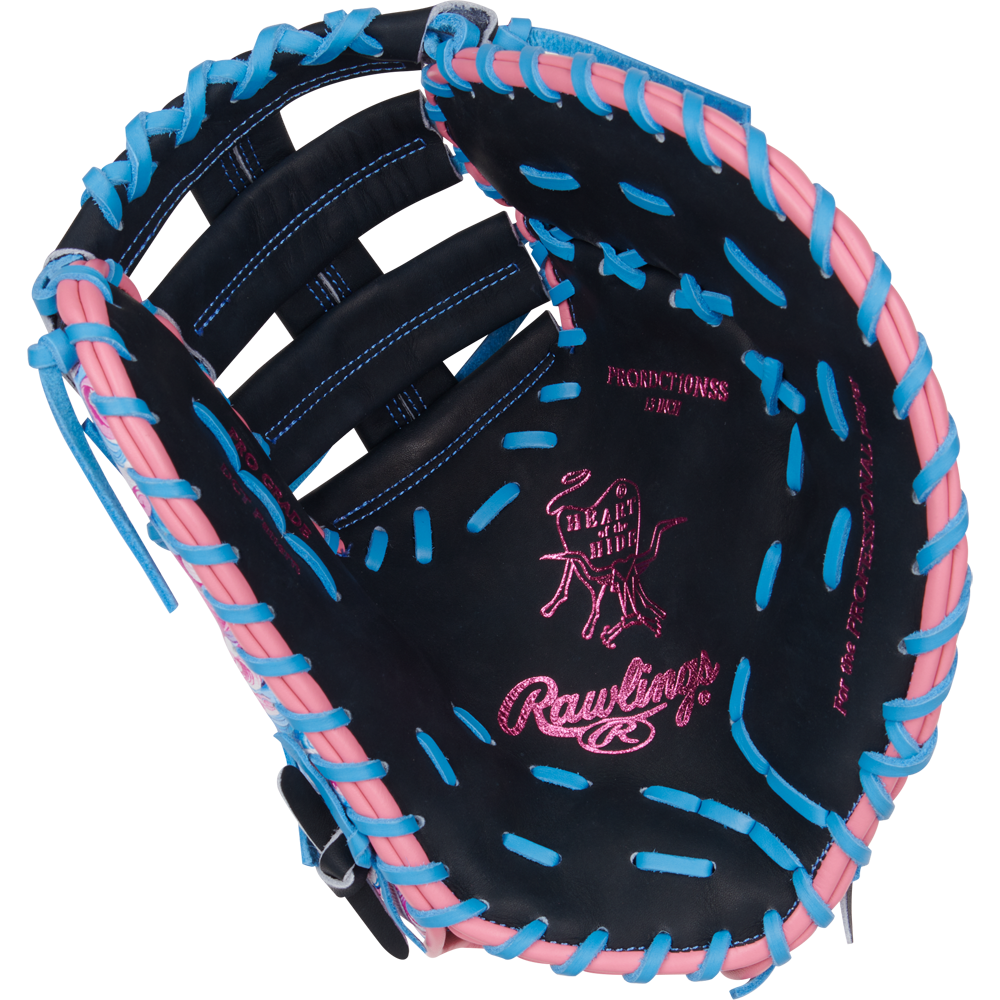 The Rawlings Heart of the Hide 13" ColorSync First Base Mitt (PRORDCT-10NSS) features black leather, pink and blue laces, pink stitching, a cow logo, and palm text—ideal as a standout mitt for first base.