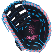 The Rawlings Heart of the Hide 13" ColorSync First Base Mitt (PRORDCT-10NSS) features black leather, pink and blue laces, pink stitching, a cow logo, and palm text—ideal as a standout mitt for first base.