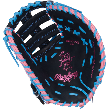 The Rawlings Heart of the Hide 13" ColorSync First Base Mitt (PRORDCT-10NSS) features black leather, pink and blue laces, pink stitching, a cow logo, and palm text—ideal as a standout mitt for first base.