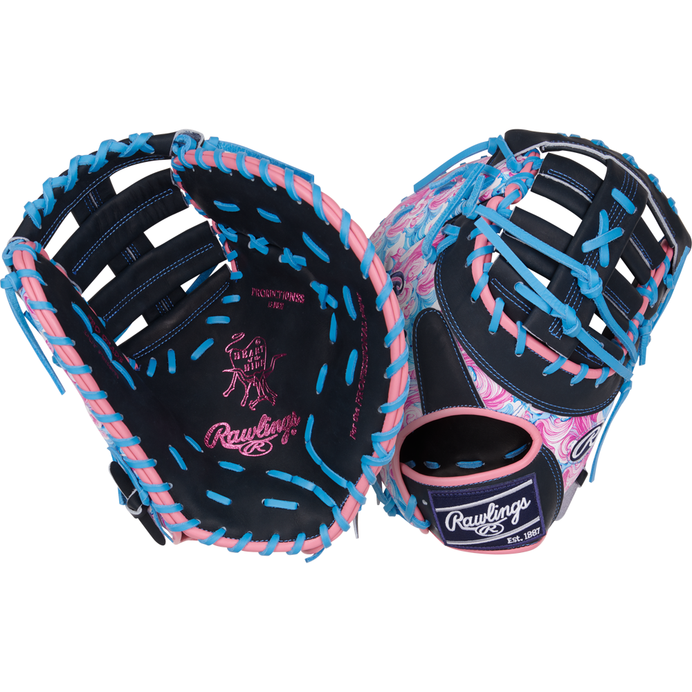 A pair of Rawlings Heart of the Hide 13" Color Sync Baseball First Base Mitts (PRORDCT-10NSS) with navy blue leather, pink palm accents, and bright blue laces—one showing the palm, the other featuring a pink swoosh pattern.