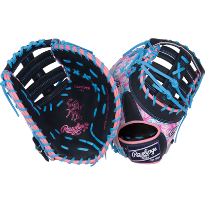 A pair of Rawlings Heart of the Hide 13" Color Sync Baseball First Base Mitts (PRORDCT-10NSS) with navy blue leather, pink palm accents, and bright blue laces—one showing the palm, the other featuring a pink swoosh pattern.