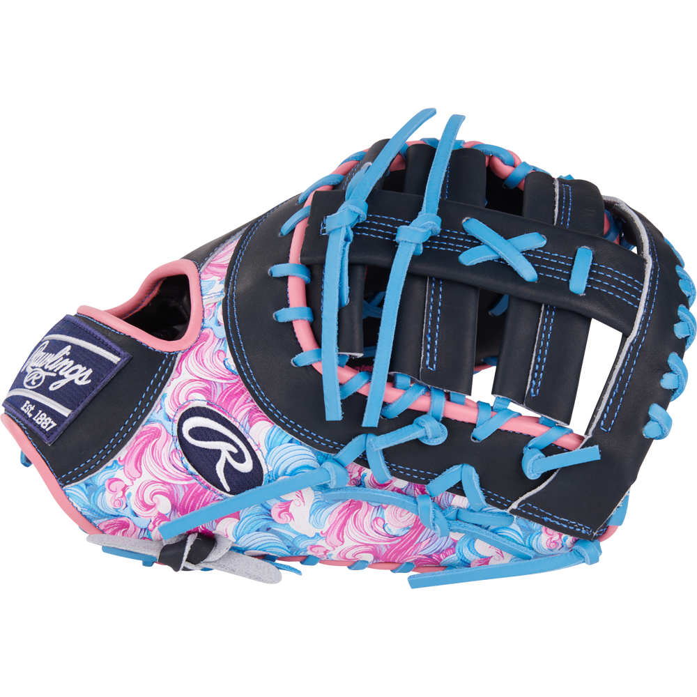 The Rawlings Heart of the Hide 13" Color Sync First Base Mitt (PRORDCT-10NSS) features a black base, blue and pink laces, swirling pink and blue thumb/palm, white stitching, and the Rawlings logo.