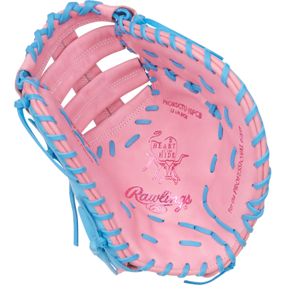The Rawlings Heart of the Hide 12.25" First Base Mitt (PRORDCTU-10PCB) features a pink design with blue lacing, ContoUR Fit, and embossed logos on the palm—combining standout style and renowned Rawlings performance.