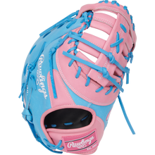A Rawlings Heart of the Hide 12.25" First Base Mitt (PRORDCTU-10PCB) features a pink and blue design with blue laces and white branding, displayed against a plain white background.