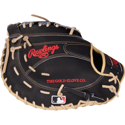 A black Rawlings Heart of the Hide 12.5" first base mitt (PRORFM18-17BCS) features tan laces, red embroidered Rawlings and THE GOLD GLOVE CO. text, and an MLB logo patch on the wrist area.