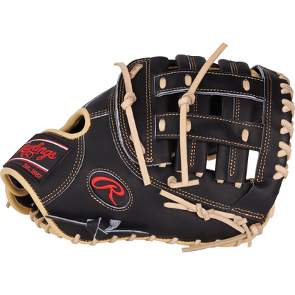 The Rawlings Heart of the Hide 12.5" First Base Mitt (PRORFM18-17BCS) is black with beige laces, a red and black Rawlings logo on the wrist strap, and classic basket-style webbing.
