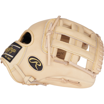 The Rawlings Heart of the Hide 12.25" Baseball Glove (PRORKB17C) features tan leather, yellow stitching, black logo patches, open web design, and lacing details—crafted in the style of Kris Bryant’s glove.