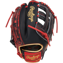 The Rawlings Heart of the Hide 12" Nolan Arenado Game Model (PRORNA28N) is a black and red glove with gold lettering, red stitching and laces, a camo thumb pattern, and a Rawlings logo patch near the wrist.