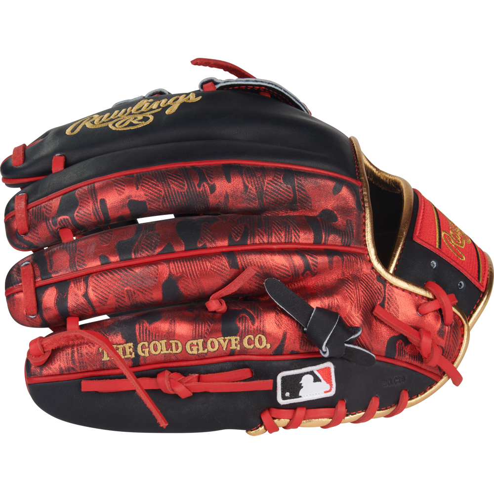 The Rawlings Heart of the Hide 12" Nolan Arenado Game Model Glove (PRORNA28N) features a black and red design with gold accents, red laces, "THE GOLD GLOVE CO." and Rawlings text, plus an MLB logo patch near the wrist opening.